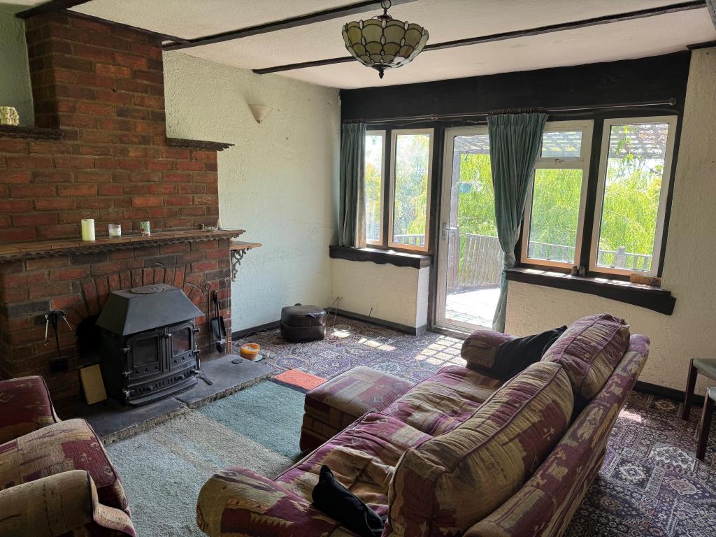 Lot: 117 - FREEHOLD DETACHED HOME WITH SIGNIFICANT STRUCTURAL DAMAGE - The Living Room and Fireplace